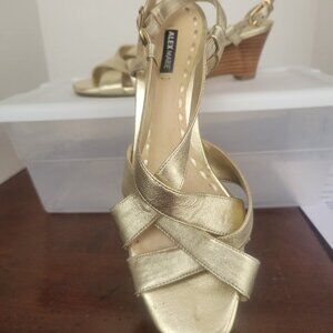 Cross-strapped metallic gold sandals